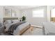 Cozy bedroom with a comfortable bed, stylish decor, and natural light from the window at 240 E Caven E St, Indianapolis, IN 46225