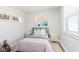Charming bedroom with a twin bed, playful decor, and a bright window at 240 E Caven E St, Indianapolis, IN 46225