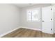 Bright bedroom with modern window and white trim, allowing ample natural light at 240 E Caven E St, Indianapolis, IN 46225