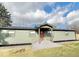 Charming single-story home with new green siding, black roof, and inviting covered entry at 240 E Caven E St, Indianapolis, IN 46225