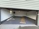 An open two-car garage with freshly painted walls and floors with ample space at 240 E Caven E St, Indianapolis, IN 46225
