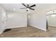 Spacious living area with luxury vinyl floors, white door, and ample natural light at 240 E Caven E St, Indianapolis, IN 46225