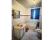 Bathroom with a bathtub, sink, window, and tile flooring at 2505 E 17Th St, Indianapolis, IN 46218