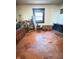 A bedroom featuring a stained wood floor, window, and various furnishings at 2505 E 17Th St, Indianapolis, IN 46218
