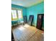 View of bedroom with natural light and colorful painted walls at 2505 E 17Th St, Indianapolis, IN 46218