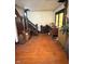 View of a historic home's entryway featuring a staircase and wood flooring at 2505 E 17Th St, Indianapolis, IN 46218