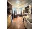Dated kitchen with light-blue walls and wooden cabinets at 2505 E 17Th St, Indianapolis, IN 46218