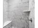Modern bathroom with marble tiled shower, built-in bench, and sleek fixtures at 2786 Kipling Dr, Carmel, IN 46033