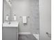 Elegant bathroom with marble shower, modern sink, and stylish tile flooring at 2786 Kipling Dr, Carmel, IN 46033