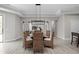 Elegant dining room boasts a modern chandelier, seating for six, and stylish sliding doors leading to another room at 2786 Kipling Dr, Carmel, IN 46033