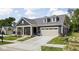 Charming single-story home with well-manicured lawn, attached garage, and covered porch at 2786 Kipling Dr, Carmel, IN 46033