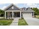 Charming single-Gathering home featuring a two-car garage, covered front porch, and well-maintained landscaping at 2786 Kipling Dr, Carmel, IN 46033