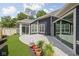 Beautiful backyard featuring a stone patio, large sliding doors, and lush lawn at 2786 Kipling Dr, Carmel, IN 46033