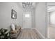 Inviting foyer with tile flooring, a decorative bench, and modern lighting at 2786 Kipling Dr, Carmel, IN 46033