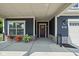 Inviting front porch with stylish columns, well-placed plants, and a cozy seating area at 2786 Kipling Dr, Carmel, IN 46033