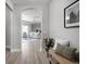 Hallway leading to a living room area, with wood-look floors and neutral walls at 2786 Kipling Dr, Carmel, IN 46033