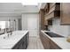 Stylish kitchen with a white sink, white countertops and backsplash, and sleek appliances and custom cabinetry at 2786 Kipling Dr, Carmel, IN 46033