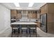 Stylish kitchen with custom cabinets, a large center island, stainless steel appliances, and modern finishes at 2786 Kipling Dr, Carmel, IN 46033