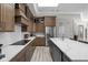 Modern kitchen features stainless steel appliances, custom cabinetry, a white subway tile backsplash, and quartz countertops at 2786 Kipling Dr, Carmel, IN 46033
