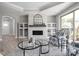 Comfortable living room featuring built-in cabinets, a white brick fireplace, and lots of natural light at 2786 Kipling Dr, Carmel, IN 46033