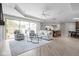 Inviting living room features a neutral palette, stylish seating, large windows, and a view into the dining area at 2786 Kipling Dr, Carmel, IN 46033