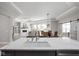 Open concept living space shows a large kitchen island with pendant lighting and dining and living areas at 2786 Kipling Dr, Carmel, IN 46033