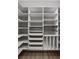Spacious walk-in closet features custom shelving, drawers, and compartments for organized storage at 2786 Kipling Dr, Carmel, IN 46033