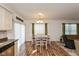 Dining area featuring hardwood floors, modern lighting and an open concept layout at 3045 Sholty Ct, Cicero, IN 46034