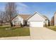 Charming single-story home with a well-maintained lawn and attached two car garage at 3045 Sholty Ct, Cicero, IN 46034