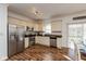 Kitchen featuring stainless steel appliances, hardwood floors, and stone tile backsplash at 3045 Sholty Ct, Cicero, IN 46034