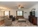 Spacious living room with neutral carpet, ceiling fan, fireplace, and plenty of seating at 3045 Sholty Ct, Cicero, IN 46034