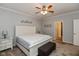 Main bedroom with a ceiling fan, white trim, carpeted floors, and neutral paint at 3045 Sholty Ct, Cicero, IN 46034