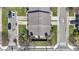 Aerial view of brick townhouses with landscaped yards and paved driveways at 310 E St Clair St, Indianapolis, IN 46202