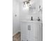 This bathroom features modern fixtures, white cabinets and industrial-style lighting at 310 E St Clair St, Indianapolis, IN 46202