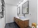 This bathroom features a double vanity with modern sinks and fixtures, and contemporary design at 310 E St Clair St, Indianapolis, IN 46202