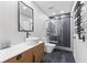 This bathroom boasts a modern design with a sleek vanity and a stylish glass-enclosed shower at 310 E St Clair St, Indianapolis, IN 46202