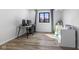 Neutral-toned bedroom featuring a desk setup and large window for natural light at 310 E St Clair St, Indianapolis, IN 46202