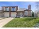 Charming brick townhouse with attached garage, balcony and well-manicured lawn at 310 E St Clair St, Indianapolis, IN 46202
