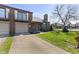 Charming brick townhouse with attached garage, balcony and well-manicured lawn at 310 E St Clair St, Indianapolis, IN 46202