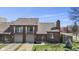 Charming brick townhouse with attached garage, balcony and well-manicured lawn at 310 E St Clair St, Indianapolis, IN 46202