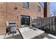 Brick townhouse back patio with furniture and sliding glass door at 310 E St Clair St, Indianapolis, IN 46202