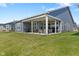 Well-maintained backyard with a covered patio, outdoor furniture, and a lush green lawn, ideal for relaxation at 3121 Arkle Rd, Westfield, IN 46074