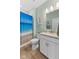 Bright bathroom featuring a white vanity and a shower with an ocean-themed curtain at 3121 Arkle Rd, Westfield, IN 46074