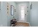 An entryway with a decorative glass door, stylish mirror, and accent table at 3121 Arkle Rd, Westfield, IN 46074