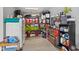 Organized garage space with storage shelves, tools, and ample room for projects at 3121 Arkle Rd, Westfield, IN 46074
