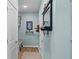 Inviting hallway features an accent wall mirror, a bench, and a coat closet at 3121 Arkle Rd, Westfield, IN 46074
