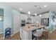 A kitchen featuring white cabinets, an island with seating, and stainless steel appliances at 3121 Arkle Rd, Westfield, IN 46074