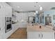 A kitchen with white cabinetry, a spacious island, and stainless steel appliances at 3121 Arkle Rd, Westfield, IN 46074