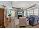 An inviting living room with a fireplace, built-in shelves, and comfortable seating at 3121 Arkle Rd, Westfield, IN 46074