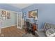 Stylish office space with wood floors, a large desk, and cozy sitting arrangement at 3121 Arkle Rd, Westfield, IN 46074